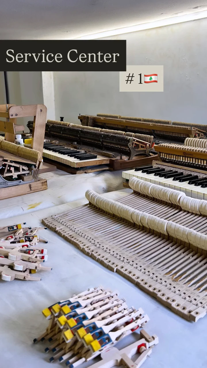 The Basbous & Sons service centre, piano actions and parts on the bench